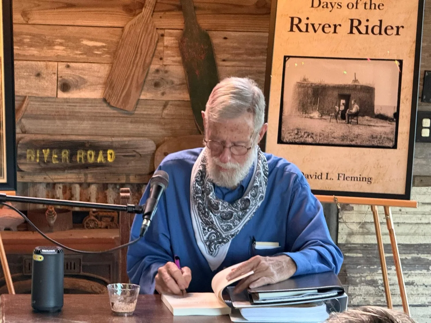 David Layton Fleming signing a book